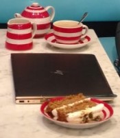 English tea, milk, and carrot cake in a London bakery